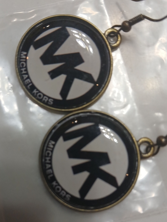 Michael Kors Jewelry - Michael Kors round logo dangle earrings feature the brand's iconic "MK" monogram
